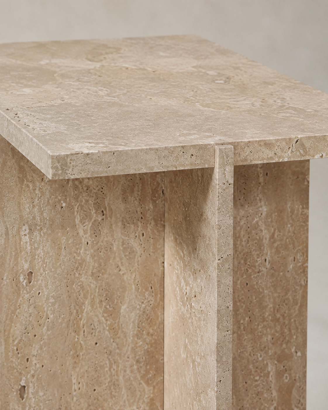 CANOVA natural beige travertine side table by DEKATO LIVING isolated on a white background