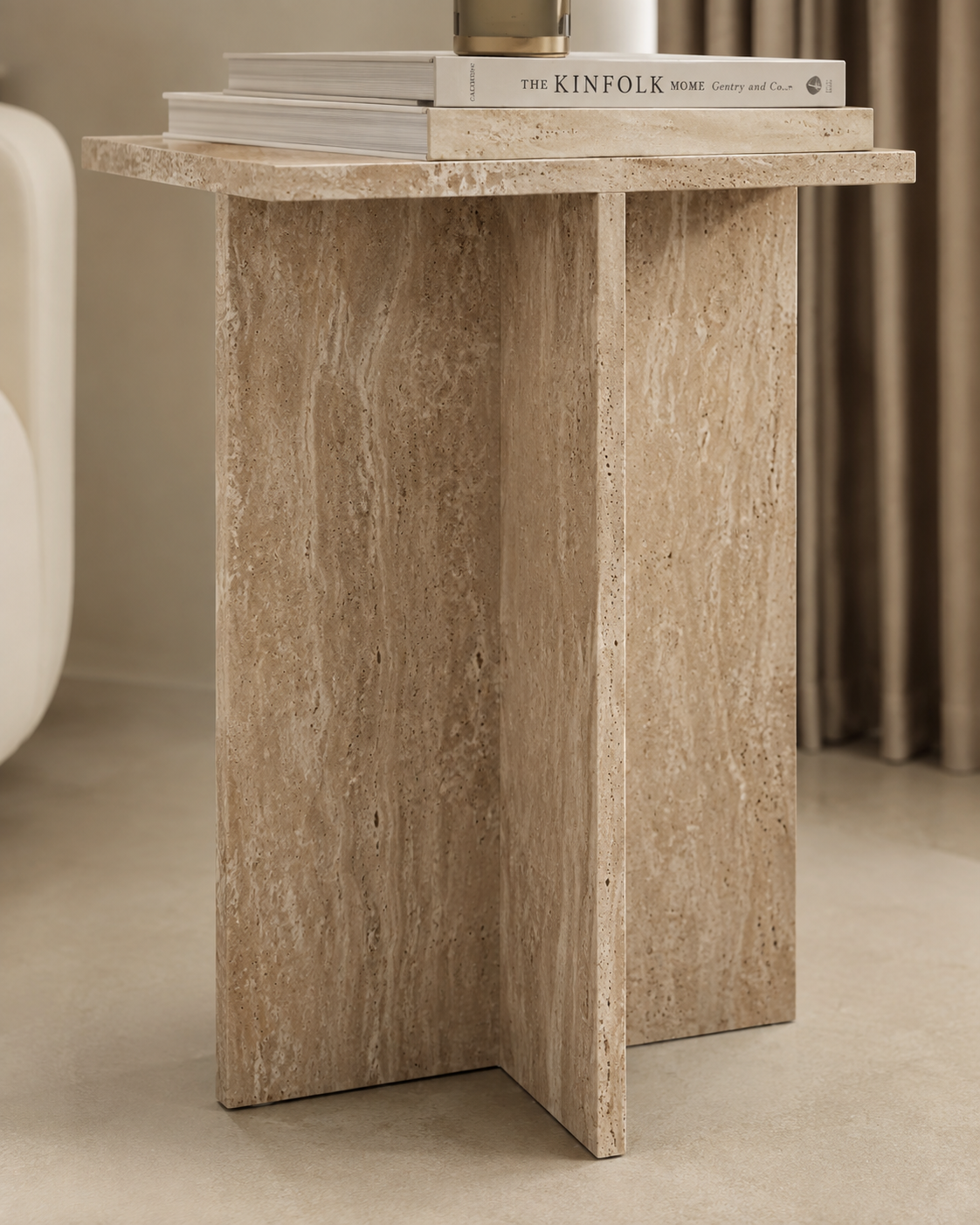 CANOVA travertine side table by DEKATO LIVING styled beside a bed with soft morning light