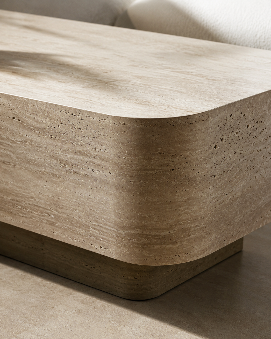 Close-up of ECHO travertine-style surface and rounded corner by DEKATO LIVING