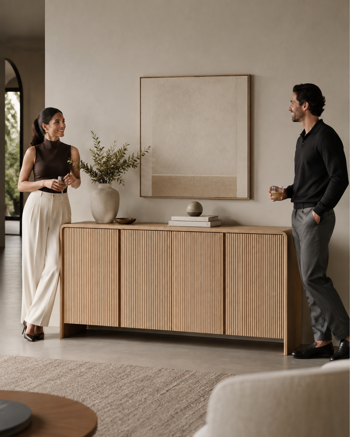 ELLE fluted sideboard by DEKATO LIVING styled with two people in neutral interior
