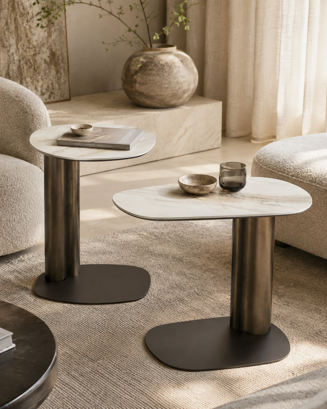 KAVO ceramic and bronze side tables by DEKATO LIVING in a warm contemporary living room