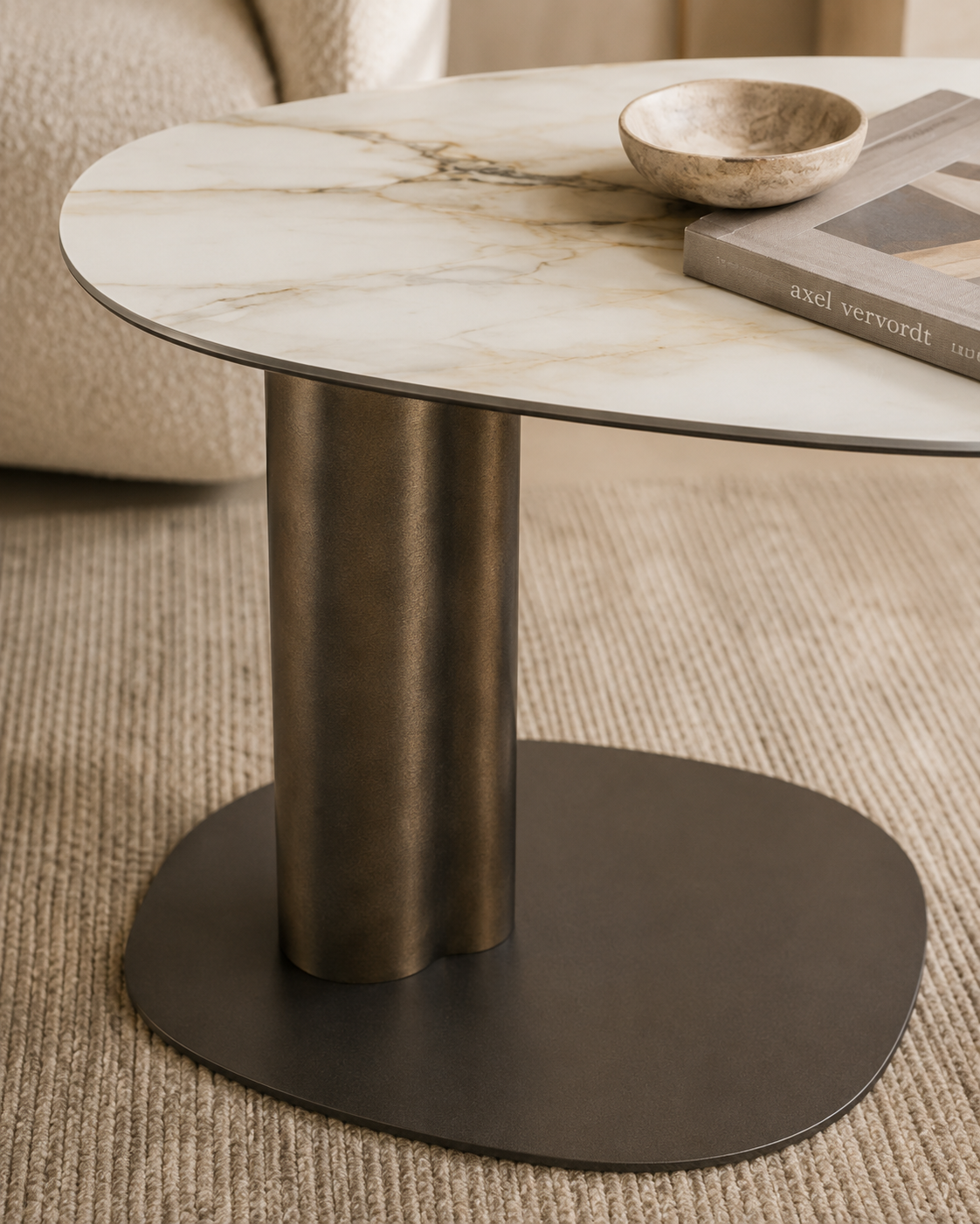 Close-up of KAVO ceramic top, brushed bronze column and embossed steel base by DEKATO LIVING