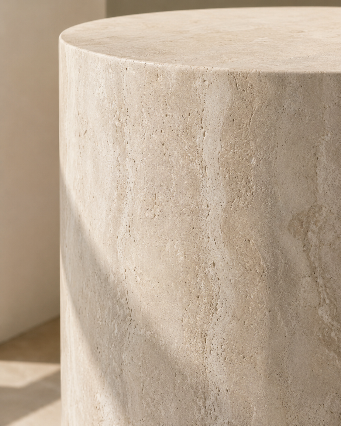 Material detail of ORLO beige natural travertine side table by DEKATO LIVING highlighting pores and mineral texture
