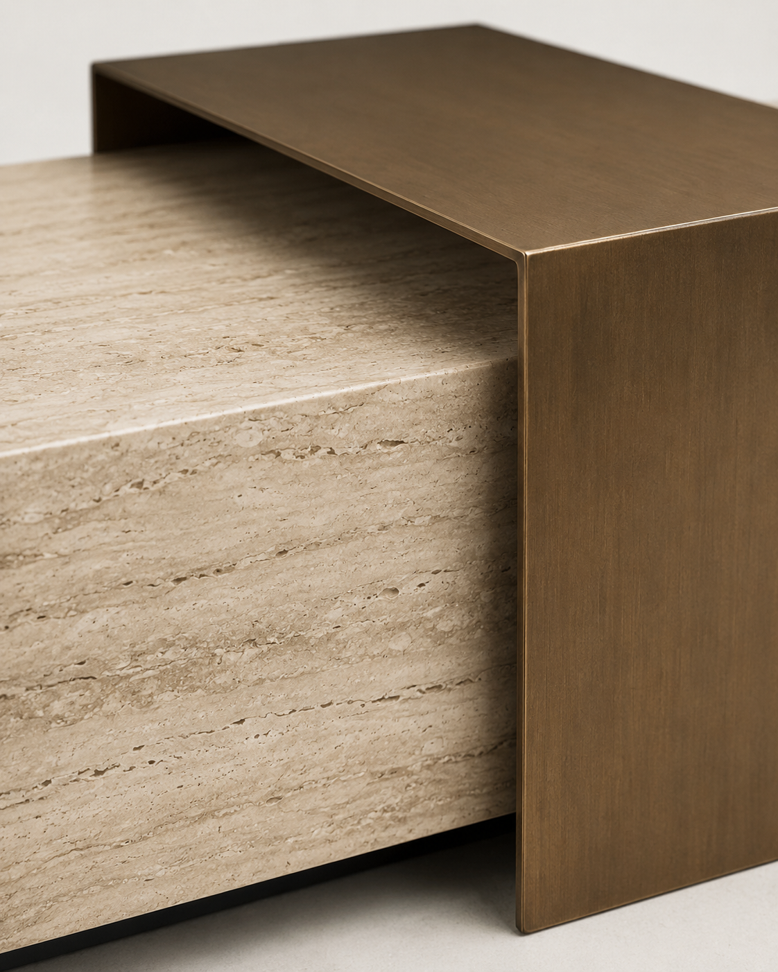 Close-up of ROCHE travertine-look ceramic surface and brushed brass bridge element by DEKATO LIVING