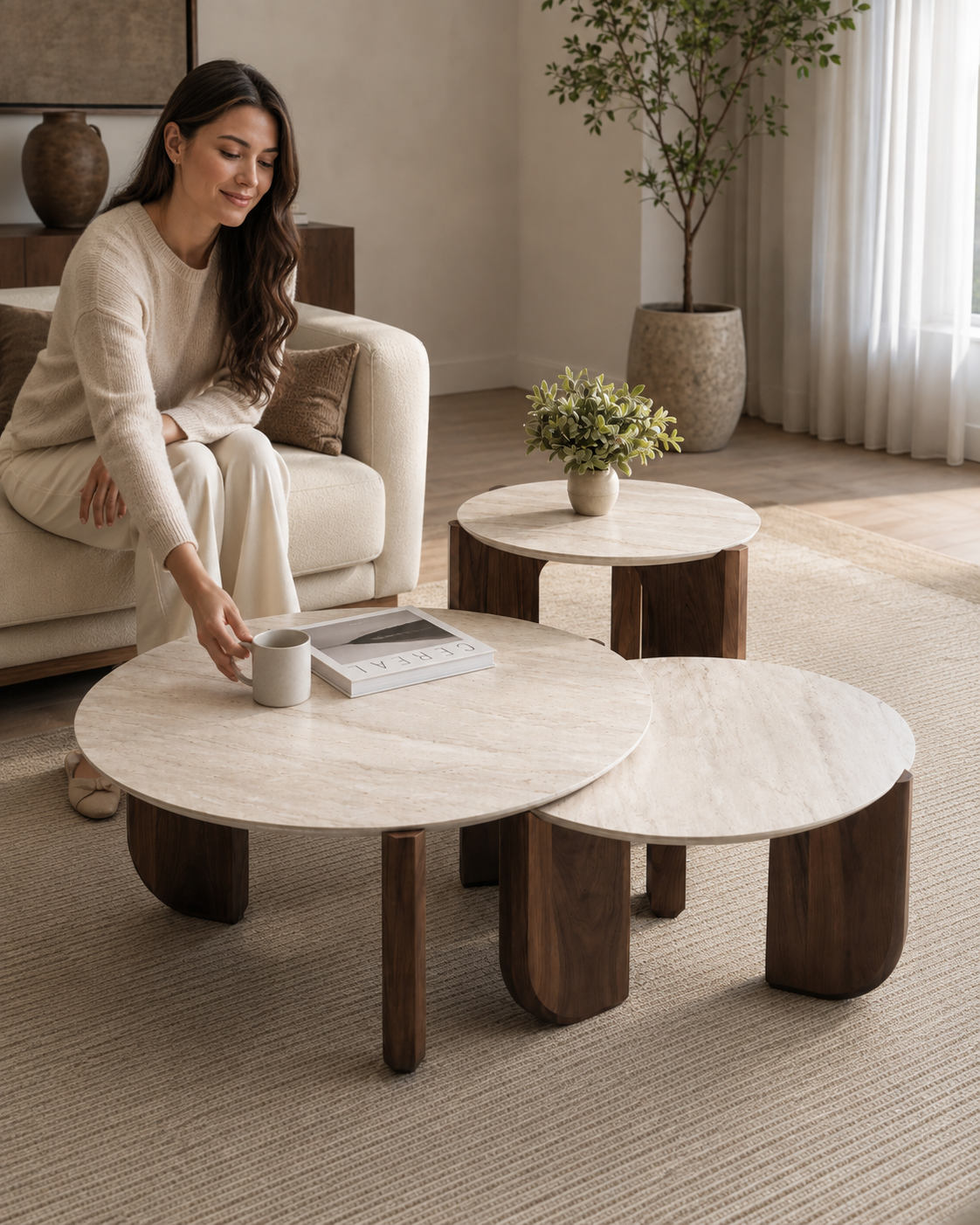 TAVO coffee table set by DEKATO LIVING styled with a woman in a contemporary living room