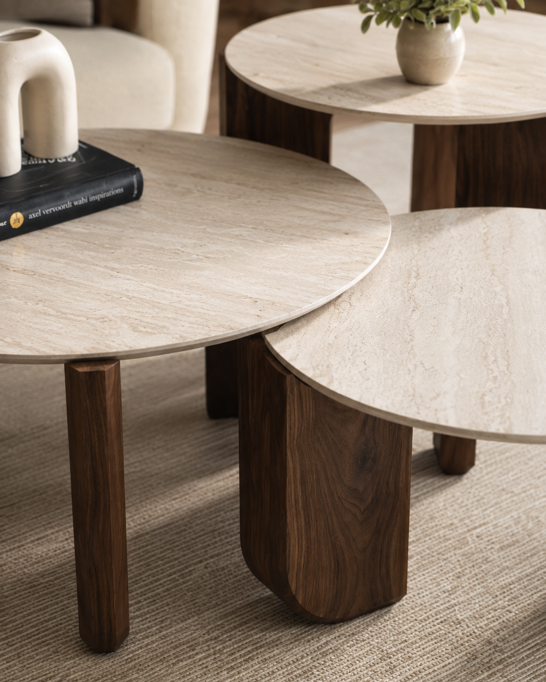 Detail view of TAVO layered tabletops and walnut veneer base by DEKATO LIVING