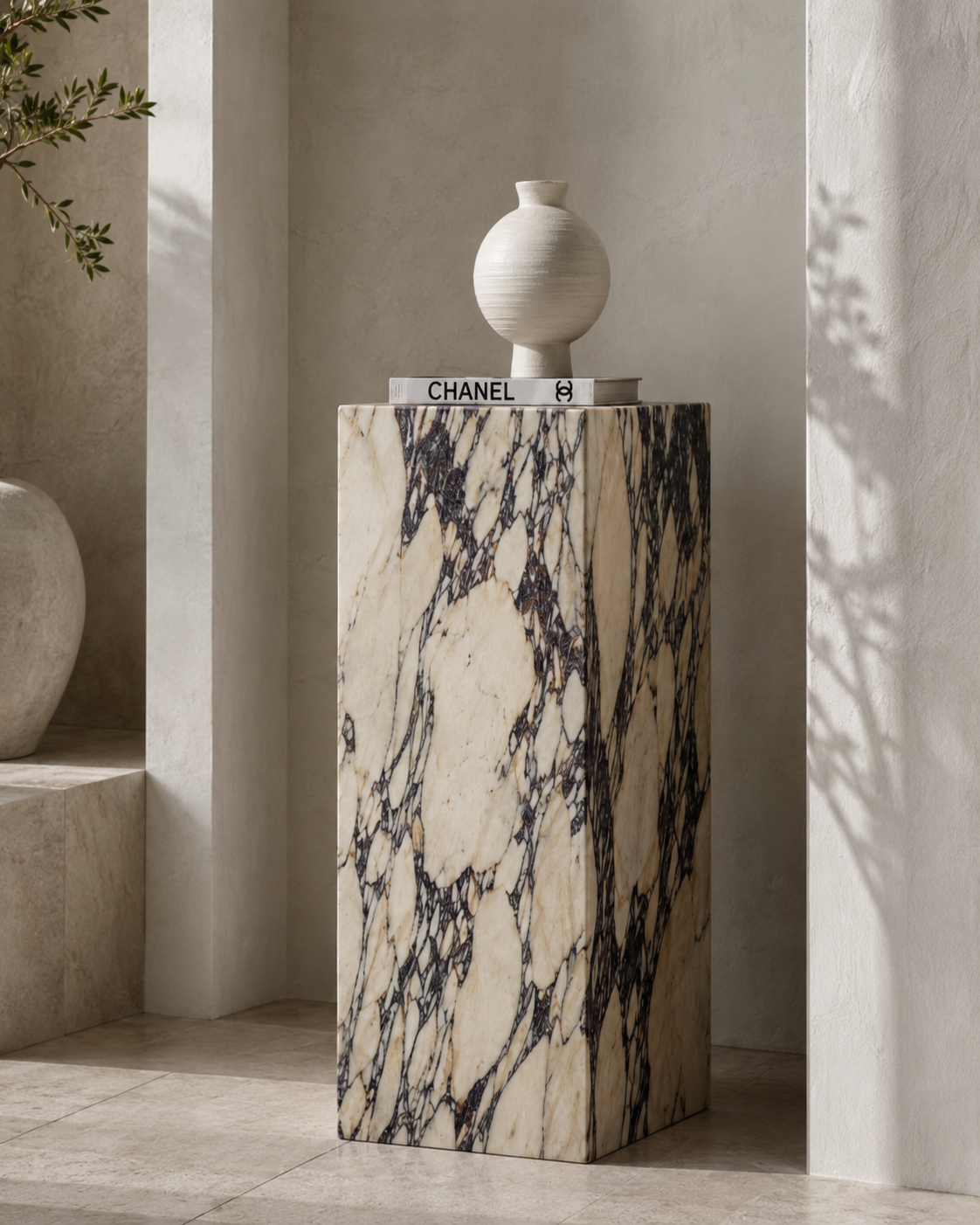 VIOLA rectangular Calacatta Viola marble display plinth by DEKATO LIVING styled in a softly lit architectural niche